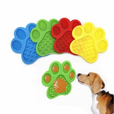 China Sustainable Anxiety Relief Dog Footprint Train Slow Feeder Silicone Pet Licking Mat With Strong Suction Back Cups for sale