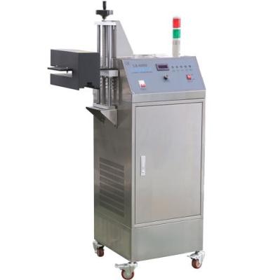 China Automatic Chemical Packaging Machine Water Cold Aluminum Foil Induction Sealing Machine for sale