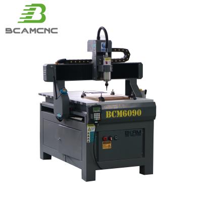 Cina Hotels BCAM 4axis 600*900mm CNC Cutting Machine 3D 6090 CNC Milling Router with Cast Iron Machine Bed in vendita