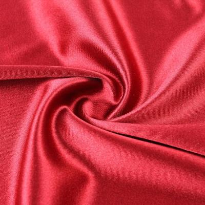 China Soft cheap price knitted satin warp polyester spot knitting fabric for clothing for sale