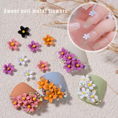 China Newest Nail Art Decoration Supplies New Arrival Alloy Metal Flower Small Frosted Black And White Three-dimensional Flower Nail Art Decoration for sale