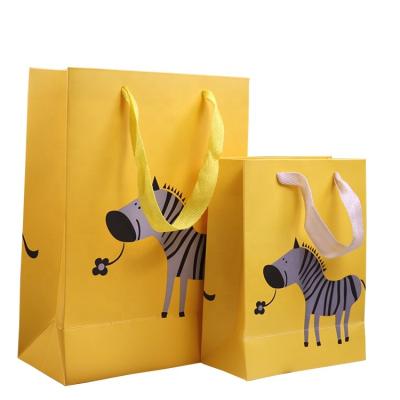 China Lovely Promotion Eco Friendly Yellow Cloth Gift Shopping Paper Bag For Kids With Ribbon Handle for sale