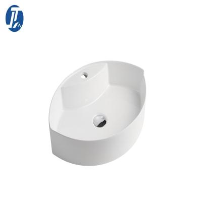 China Modern Manufacturers Wholesale Leaf Shape Ceramic Wash Basin Bathroom Sink Countertop Basin for sale