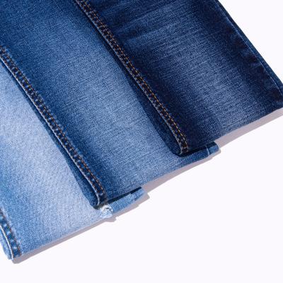 중국 66 Percent Cotton Dark Indigo Denim Fabric Mens Womens Jeans Fabric 판매용