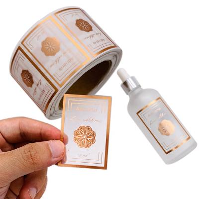 China Logo Labels Clear Waterproof Gold Transparent Foil Vinyl Waterproof Custom Printing Roll Self Adhesive Labels for sale