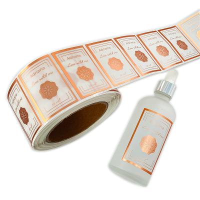 China Custom Printing Self Adhesive Roll Waterproof LOGO Label Transparent Clear Gold Foil Sticker for sale