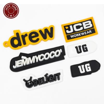 China Viable Custom 3D Silicone Raised Effect Logo Rubber Embroidered Patch Rubber Labels for sale