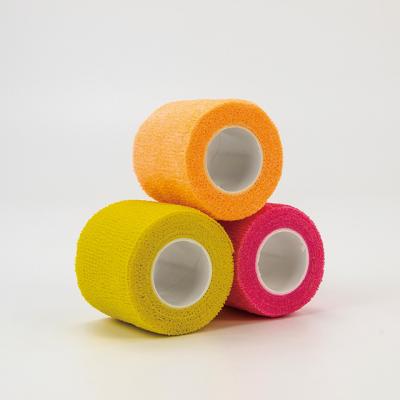 China Soft Top quality cohesive elastic bandage adhesive flexible colored non-woven for various training for sale