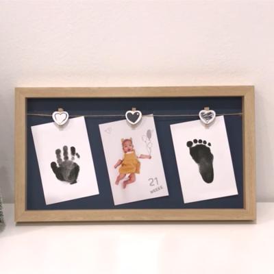 China Fashionable Amazon Best Seller Newborn Baby 12 Months Photo Frame With Touch Ink Pad Baby Footprint Clean Handprint Picture Frame Newest for sale