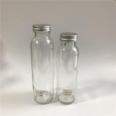 China Beverage 250ml 350ml 500ml Clear Smoothie Glass Bottle Juice Brew Bottle Aluminum Flint Beverage Screw Lid for sale