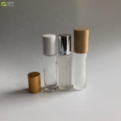 China Cosmetic 5ml 10ml 15ml Frosted Clear Thick Glass Roll On Bottle Metal Housing Ball Silver White Screw Cap Bamboo Lid for sale