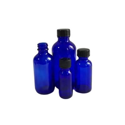 China 15ml 30ml 60ml 120ml 240ml 480ml 1000ml Boston Round Glass Cosmetic Cobalt Blue Phenolic Bottle w/black cap for sale