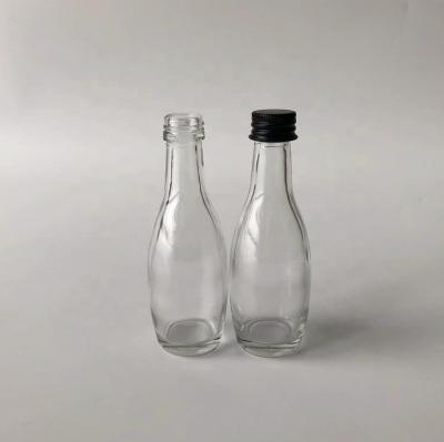 China Spirit Small Liquor 30ml 50ml Glass Wine Bottle With Black Aluminum Cap Wedding Favors Homemade Drinks Gift Packaging for sale