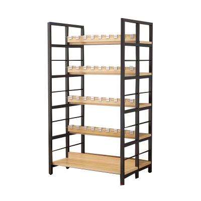 China Modern Supermarket Shelf Miniso Mall Beauty Product Display Stand Wooden Cosmetic Rack for sale