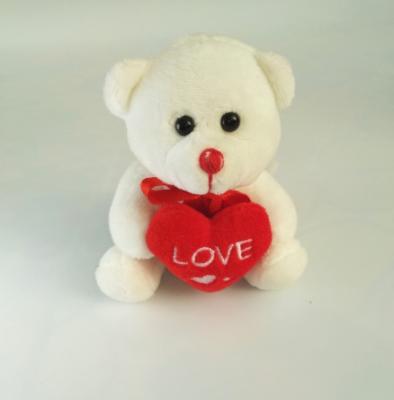 China Free sample 10cm lovely mini bear with heart plush toy stuffed teddy bear with heart toy valentine's gift small bear toy with heart for sale