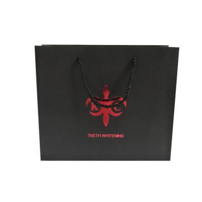 China Recyclable Silver Hot Stamping Logo& Black Cardboard Gold Custom Paper Bag for sale