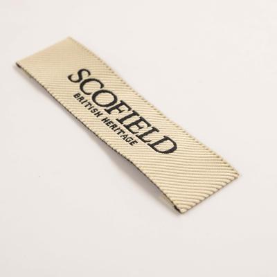 China Viable Customized Cheap Black Twill Flat Woven Labels For Clothing With Brand Logo for sale