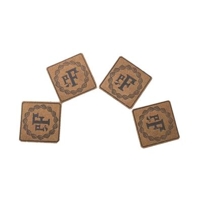 China Durable PU Leather Label For Apparel, Patches For Hat, Accessory Manufacturer Sew On Logo Custom Design Debossed for sale