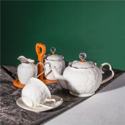 China Viable Wholesale Custom Heart Decor Embossed Design Chinese Modern White Porcelain Tea Set With Teapot for sale