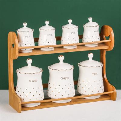 China Sustainable Top Grade High Quality Wares Kitchen Take Care Porcelain Spice Jar With Wooden Rack for sale