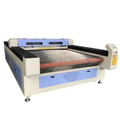 China Laser CUTTING Fabric Laser Cutting Machine With Automatic Feeder CO2 Laser Cutting Machine FW-1325 for sale