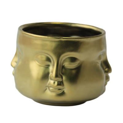 China Birthdays Gold Jar Ceramic Candle Custom Electroplating Soy Scented Candle in Unique Design Buddha Head Face Candle Jars for sale