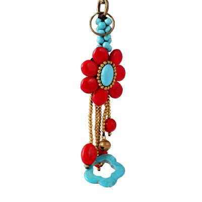 China Creative Turquoise Flower Shaped Cavity Turquoise Key Chain Customized Hanging Braided Bronze Key Chain Bohemian Style for sale