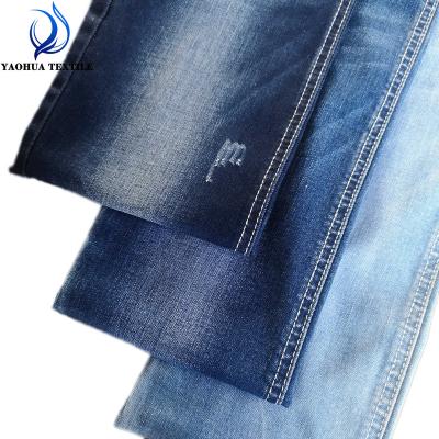 China CK068 anti-static wick TR ring spinning lightweight low elasticity stretch cotton polyester lycra jeans fabric for sale