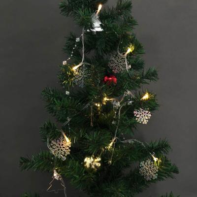 China Indoor Plastic Snowflake 10L LED String Lights Christmas Tree Decoration Snowflake Pine Tree Ornament for sale