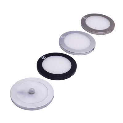 China Modern Surface Mounted Round 12V Sensor Cabinet Puck Stick On Led Lights Under Cabinet Downlight for sale