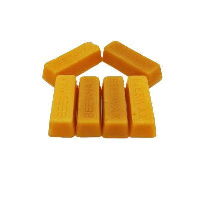 China Food pharmacy cosmetics low price cosmetics grade honey beeswax beeswax bar with good quality for sale