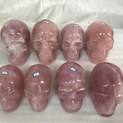 China Europe custom made high quality natural rock rose rose quartz crystal skulls for sale