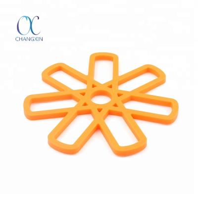 China Viable Candy Color Flower Shape Silicone Kitchen Table Anti-Slip Protector For Pot Pan for sale