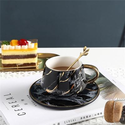 China Sustainable Hot Sale Coffee Hotel Used Drinkware Luxury Gold Black Handle Ceramic Marble Tea Coffee Cup With Saucer for sale