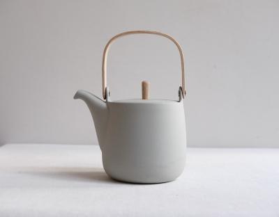 China Sustainable Eco-Friendly Personalized Gray Ceramic Matte Kettle Teapot European Teapot With Wooden Handle for sale