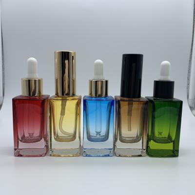 China 5ml 10ml 15ml 20ml 30ml 50ml 100ml modern gradient color square essential oil glass bottle with dropper cap for sale