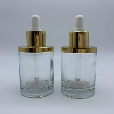 China 30ml Shoulder Cylinder Glass Plated Flat Bottle For Essential Oil 30ml Dropper Glass Bottle With Cap for sale