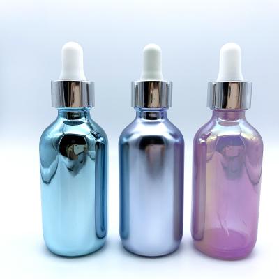 China Solid Color Cosmetic Cylindrical Clad Empty Essential Oil Glass Bottle Can Be Customized for sale