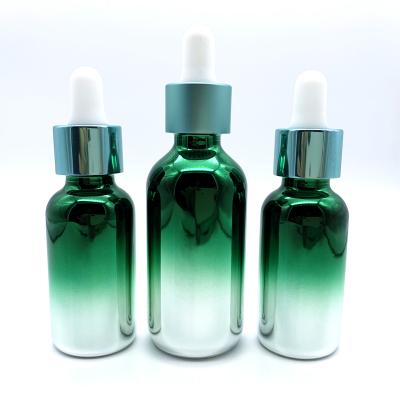 China New Gradient Essential Oil Cosmetic Electroplating Green Glass Bottle With White Rubber Head Dropper for sale