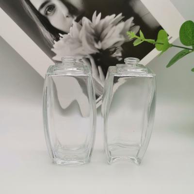 China Cosmetic Clear Flat Shoulder 50ml Perfume Bottle Empty Glass Spray Bottle for sale