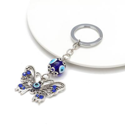 China Hot Delicate Metal Style Evil Eye Key Chain Butterfly Key Ring In Stock for sale