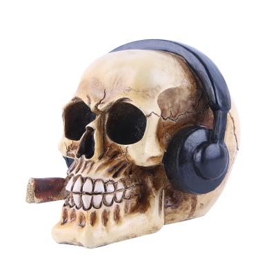 China Europe Decorations High Quality Home Statue Resin Crafts Handmade Skeletons Heads With Earphone Halloween Decor Gift Figures for sale