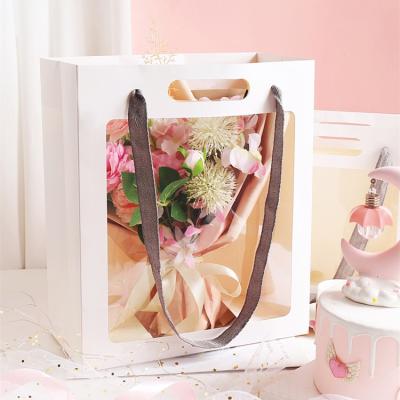 China Wholesale Recyclable Creative Clear Window Bouquet Flower Carrier Gift Packaging Portable Paper Bag for sale