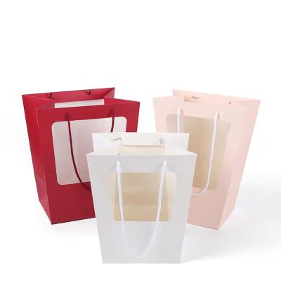 China Recyclable Promotional Shopping White Paper Bag Usage Matt Bouquet Flower Carry Art Trapezoid Coated Paper Bag With PVC Window for sale