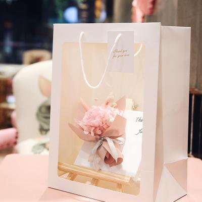 China New Design Recyclable Wholesale Creative Clear Window Bouquet Flower Carrier Gift Packing Portable Paper Bag for sale