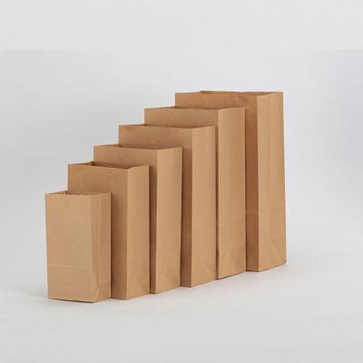 China Recyclable Paper Bag Triangle With Handle Washed Kraft Paper Storage Bag Reusable Paper Bag Groceries for sale