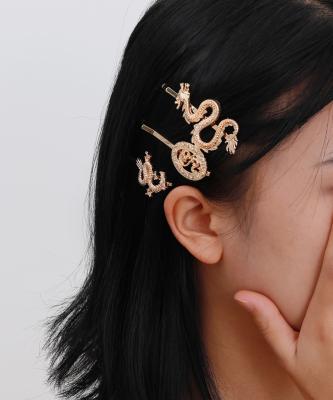 China Unique Trendy Chinese Style Jewelry Dragon Suit Hairpin Personality Geometry Clip One Edge Hollow Character Clip Woman for sale