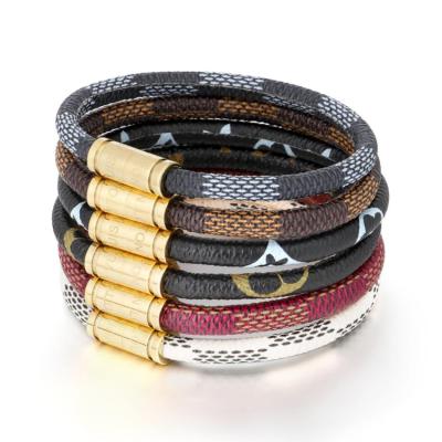 China CLASSIC Old Titanium Color Cowhide Rope Bracelet Stainless Steel Magnetic Engraved Buckle for Men and Women Bracelet for sale