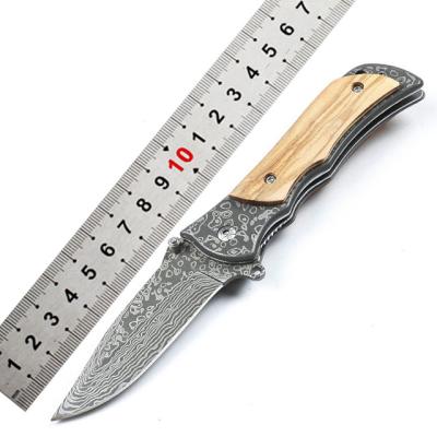 China Easy Carry Folding Knife With Laser Pattern Outdoor Camping Tactical Self Defense for sale