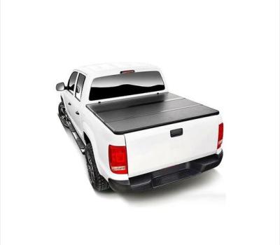 China Brief & Single Color The UK Np300 Pickup Truck Tonneau Triple Hard Retractable Bed Cover Rear Cover for sale